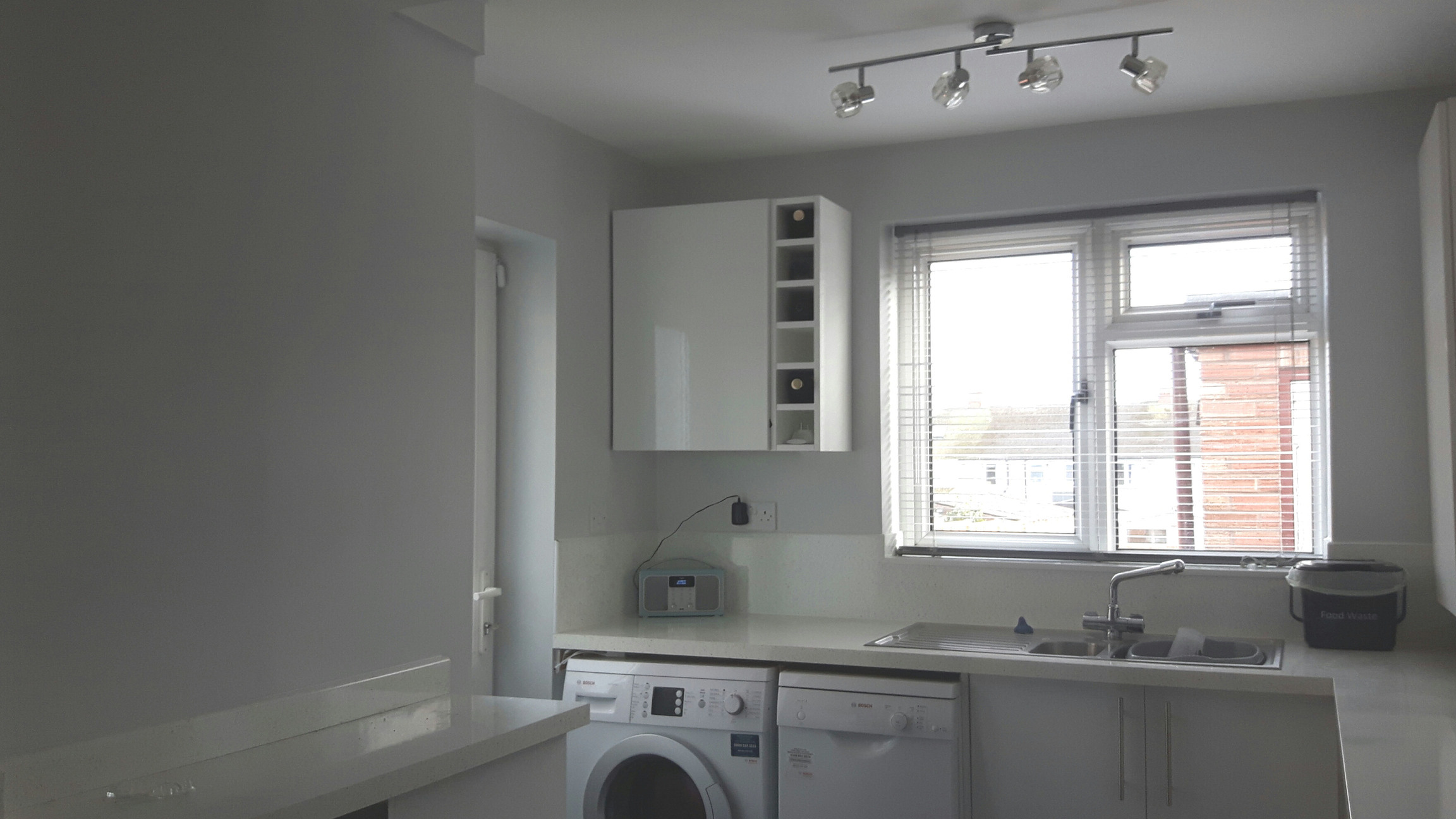 White painted kitchen with white goods 